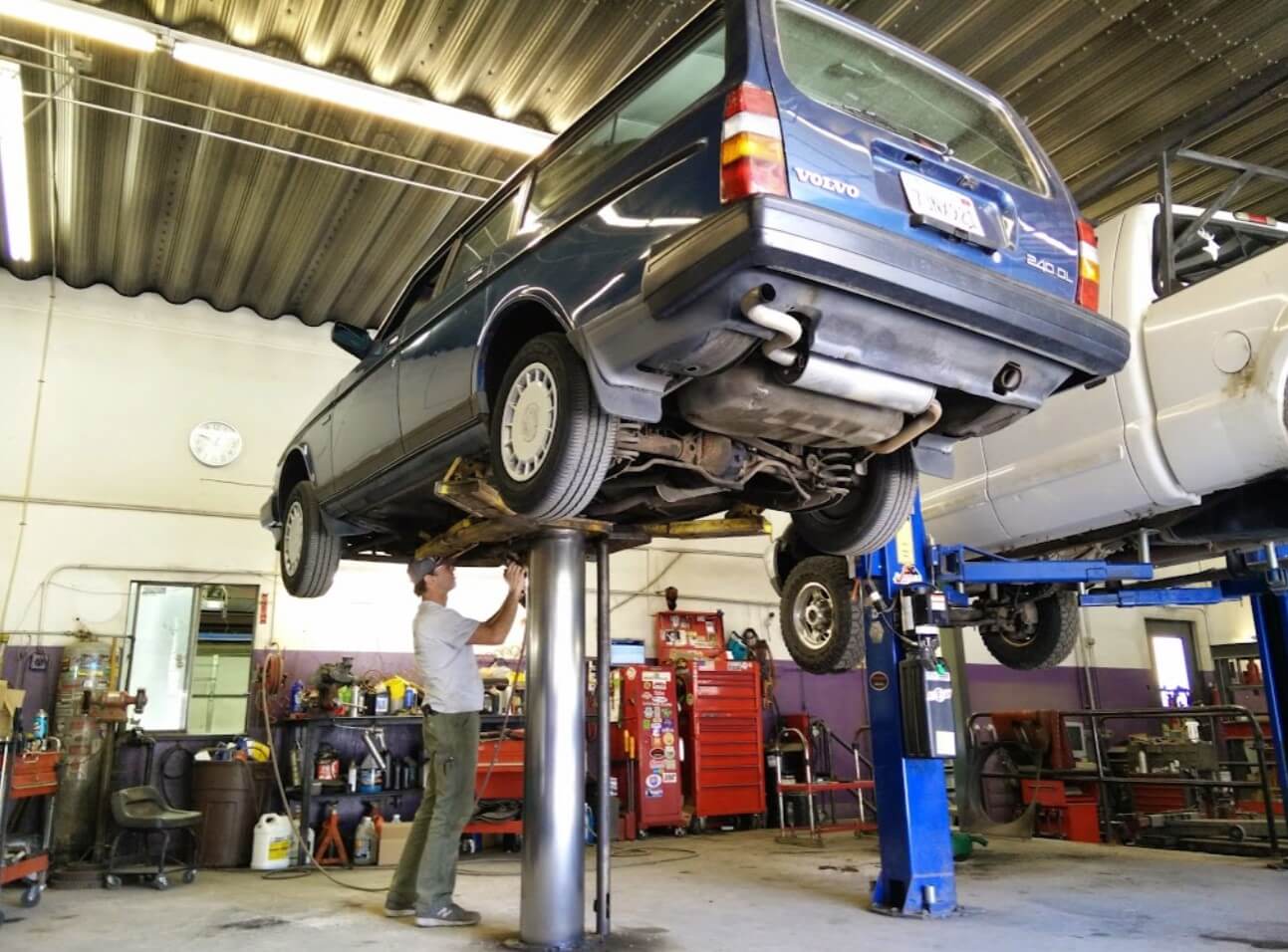 Mechanic working under a vehicle on the lift at Durango Autoworks